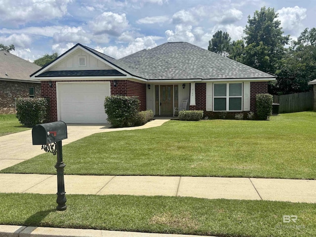 8185 Savage Loop, Theodore, AL 36582 - view of front of property with a garage, brick siding, driveway, and a shingled roof