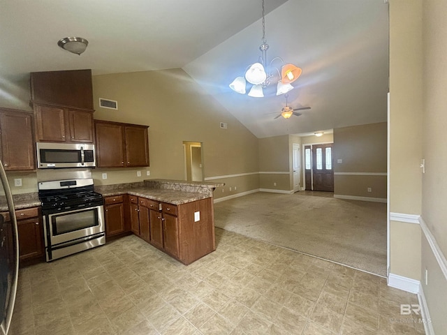 8185 Savage Loop, Theodore, AL 36582 - kitchen with appliances with stainless steel finishes, a peninsula, a chandelier, light floors, and ceiling fan