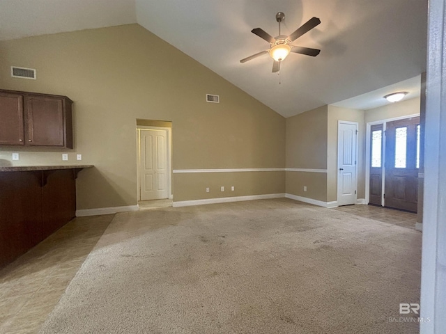 8185 Savage Loop, Theodore, AL 36582 - unfurnished living room featuring light carpet, ceiling fan, and high vaulted ceiling