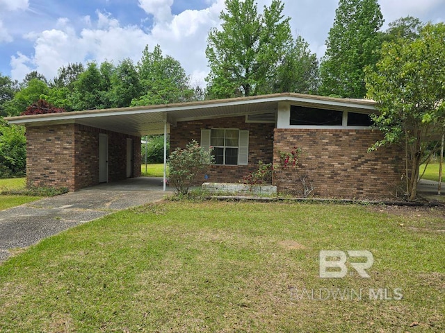 mid-century inspired home featuring a front lawn, brick siding, and driveway