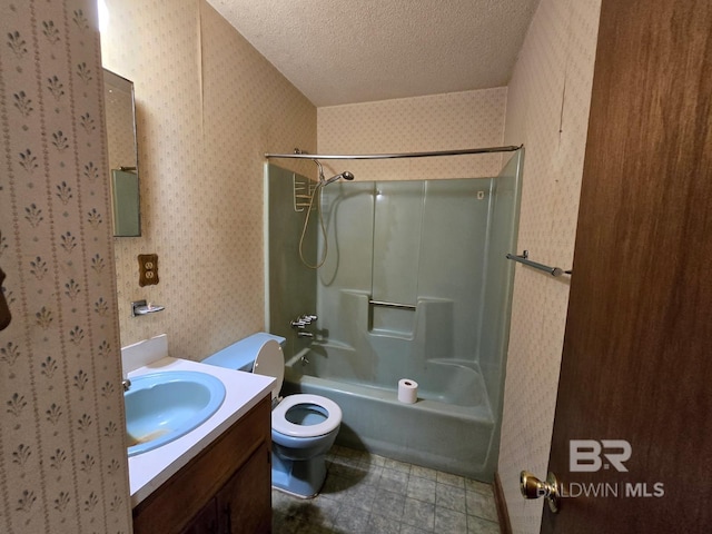 full bathroom featuring tile patterned floors, a textured ceiling, wallpapered walls, vanity, and toilet