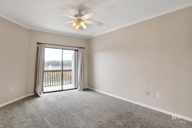 carpeted empty room featuring ceiling fan, crown molding, and a textured ceiling