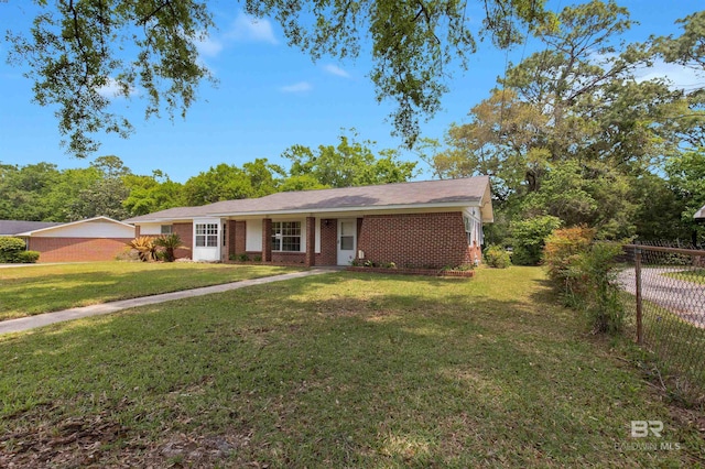 single story home with fence, a front lawn, and brick siding