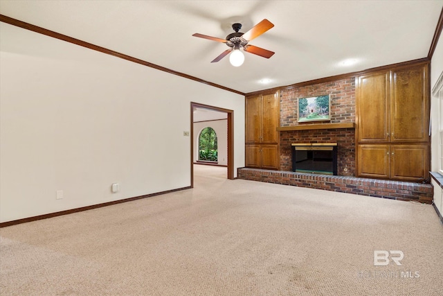 3761 Winford Rd, Mobile, AL 36619 - unfurnished living room with carpet, baseboards, a fireplace, ornamental molding, and a ceiling fan