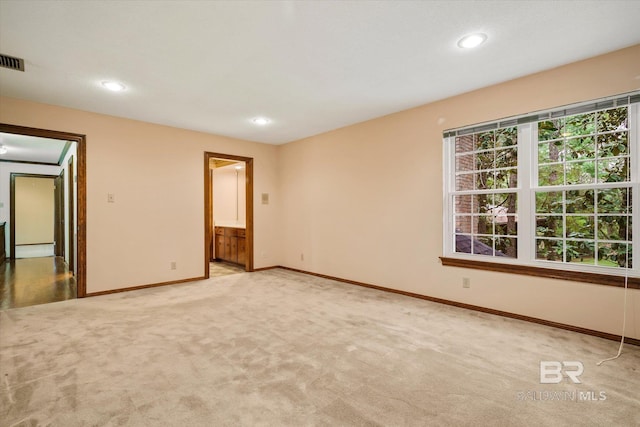 3761 Winford Rd, Mobile, AL 36619 - unfurnished bedroom featuring light colored carpet, recessed lighting, baseboards, ensuite bath, and visible vents
