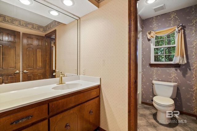 3761 Winford Rd, Mobile, AL 36619 - bathroom featuring visible vents, wallpapered walls, toilet, and vanity