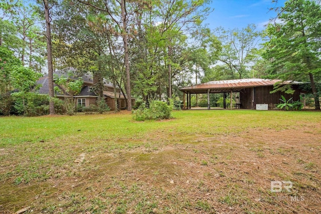 3761 Winford Rd, Mobile, AL 36619 - view of yard featuring an attached carport, an outbuilding, and a pole building
