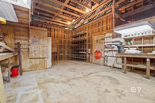3761 Winford Rd, Mobile, AL 36619 - miscellaneous room with unfinished concrete floors and a workshop area