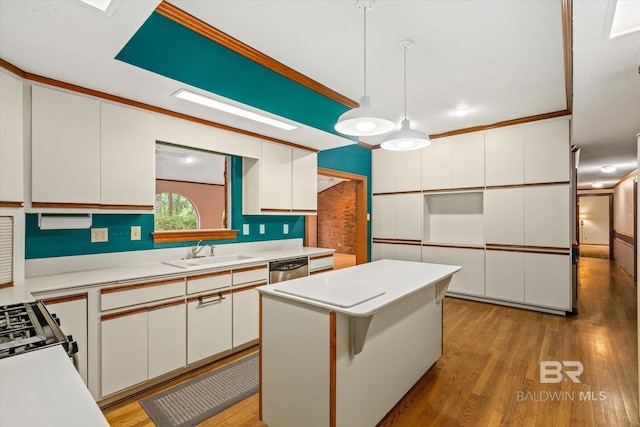 3761 Winford Rd, Mobile, AL 36619 - kitchen featuring stainless steel dishwasher, white cabinetry, light countertops, and a sink