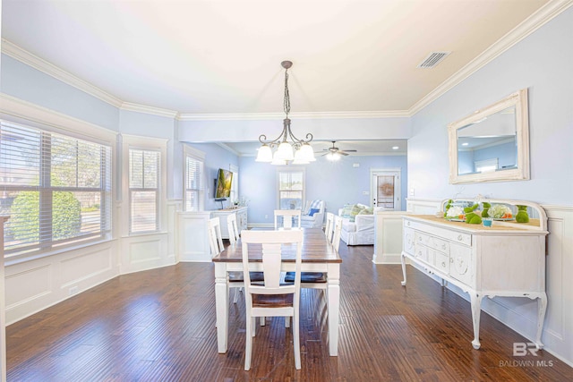 8856 Asphodel Ln, Daphne, AL 36526 - dining room with a decorative wall, crown molding, a chandelier, dark wood-style flooring, and a wainscoted wall