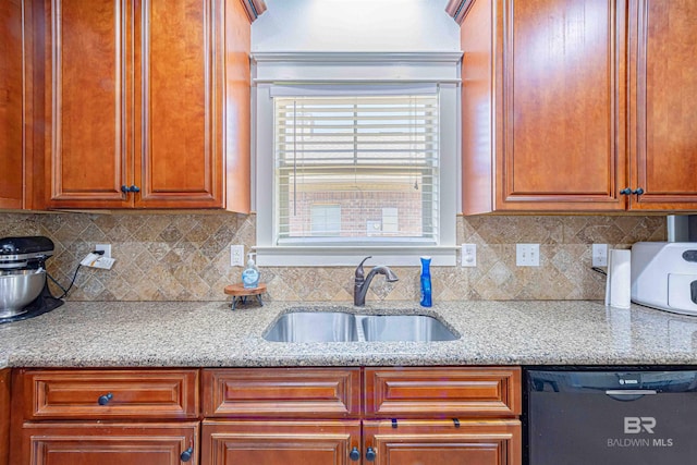 8856 Asphodel Ln, Daphne, AL 36526 - kitchen with dishwashing machine, backsplash, and light stone countertops
