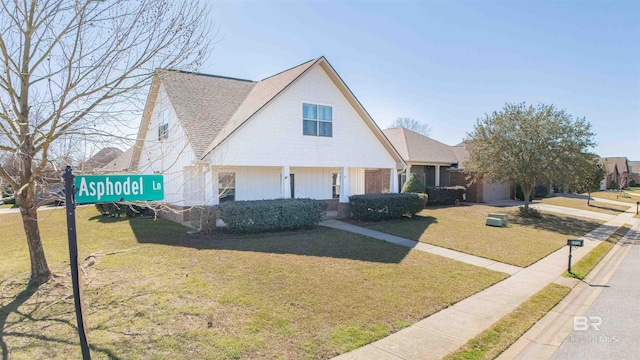 8856 Asphodel Ln, Daphne, AL 36526 - view of front of property featuring a front lawn and roof with shingles