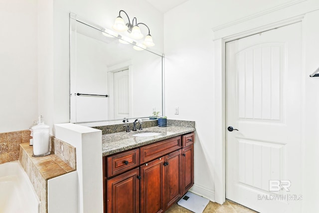 bathroom featuring a tub to relax in and vanity