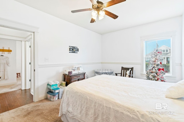 bedroom featuring ceiling fan and wood-type flooring