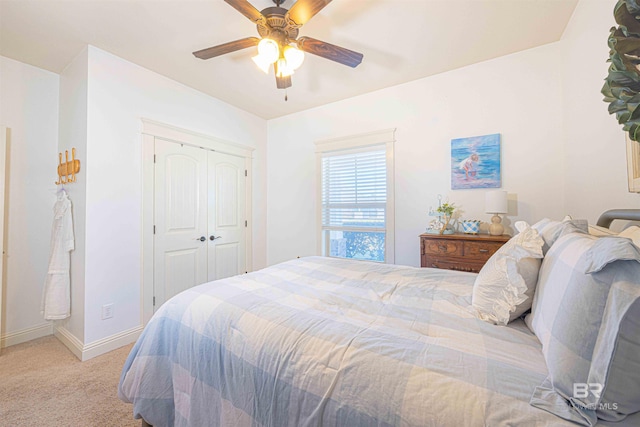 8856 Asphodel Ln, Daphne, AL 36526 - bedroom with light carpet, a closet, and a ceiling fan