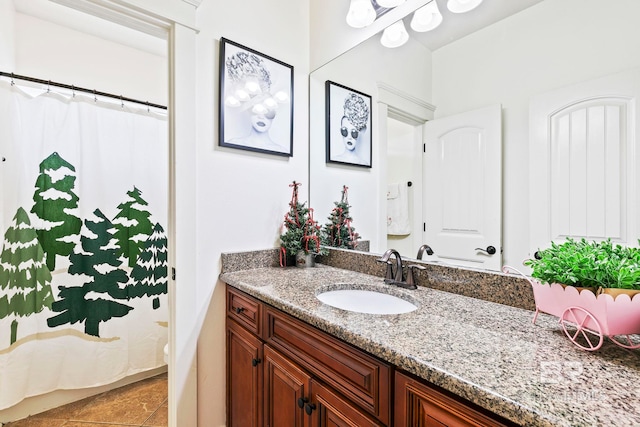 bathroom with tile patterned flooring and vanity