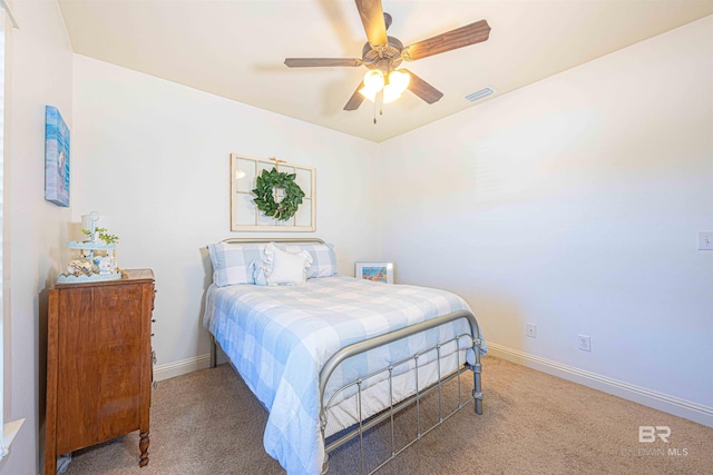 8856 Asphodel Ln, Daphne, AL 36526 - carpeted bedroom with baseboards and a ceiling fan