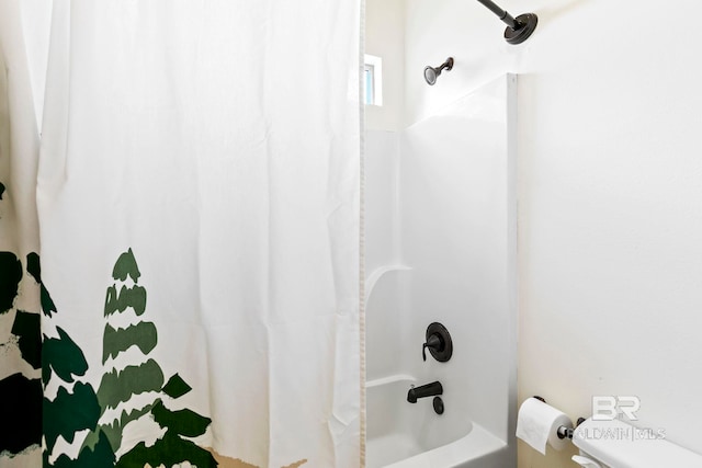 bathroom with shower / bathtub combination with curtain