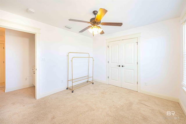 8856 Asphodel Ln, Daphne, AL 36526 - unfurnished bedroom with carpet floors, a closet, and a ceiling fan