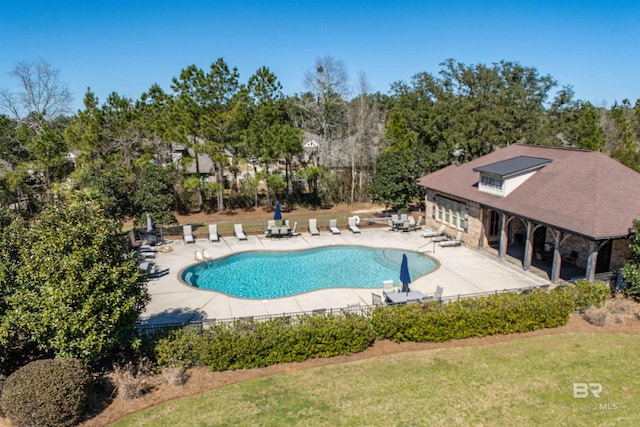 8856 Asphodel Ln, Daphne, AL 36526 - community pool with a patio, a lawn, and view of wooded area