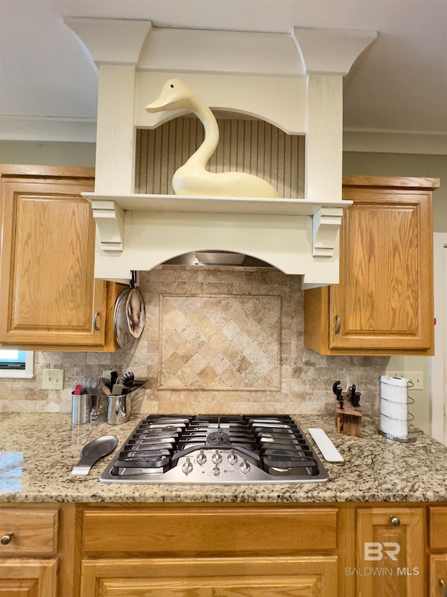 51600 State Highway 59, Bay Minette, AL 36507 - kitchen with stainless steel gas cooktop, tasteful backsplash, exhaust hood, and light stone countertops