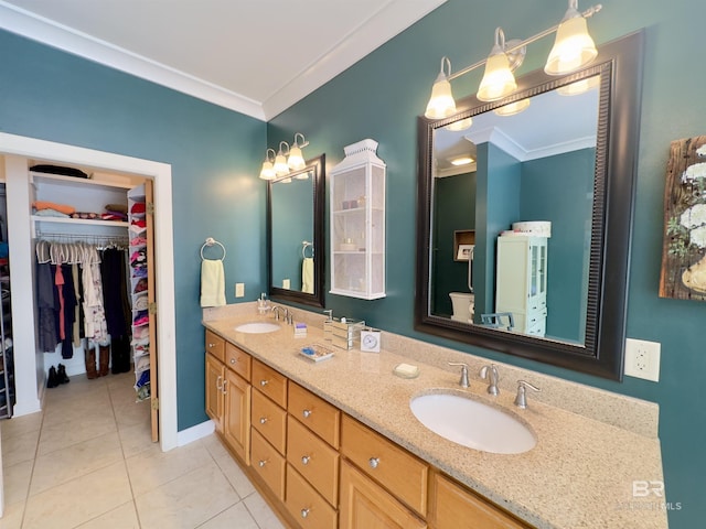 51600 State Highway 59, Bay Minette, AL 36507 - full bath featuring crown molding, double vanity, tile patterned floors, a walk in closet, and baseboards