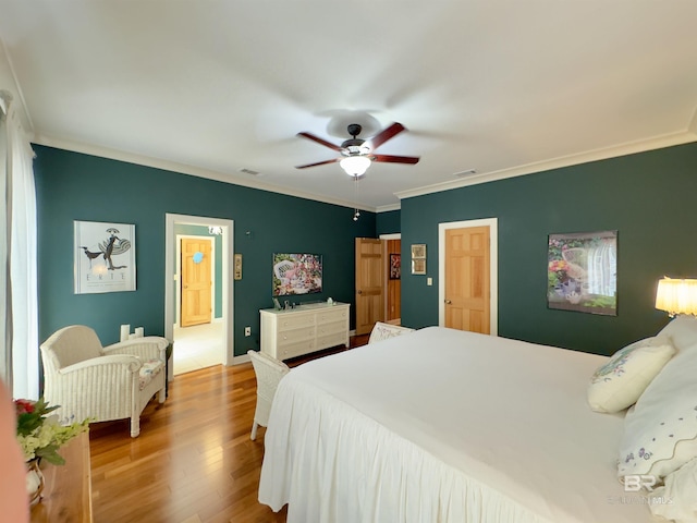 51600 State Highway 59, Bay Minette, AL 36507 - bedroom with ornamental molding, wood finished floors, and a ceiling fan