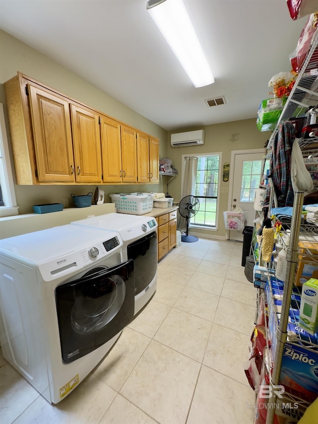51600 State Highway 59, Bay Minette, AL 36507 - laundry area with a wall mounted air conditioner, cabinet space, separate washer and dryer, and light tile patterned flooring
