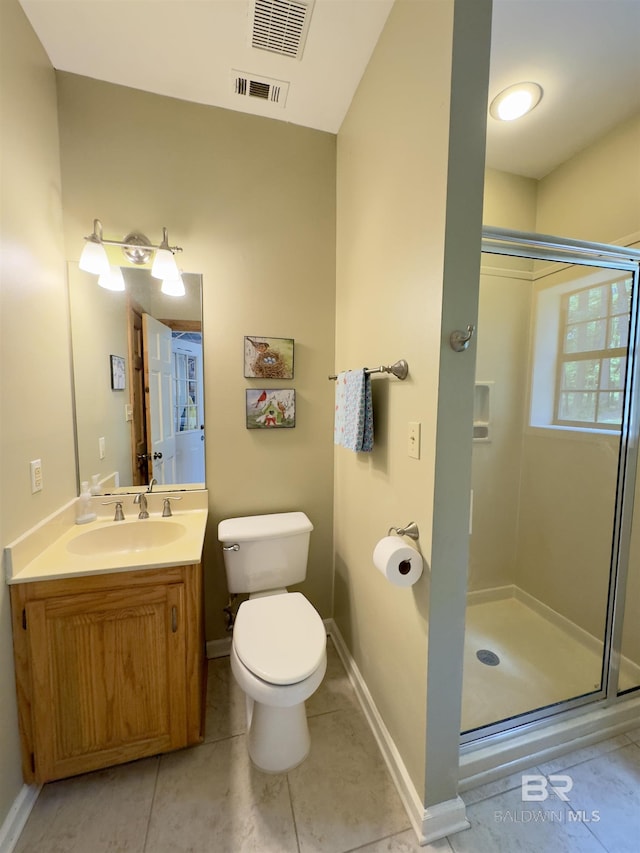 51600 State Highway 59, Bay Minette, AL 36507 - bathroom with a shower stall, toilet, vanity, tile patterned flooring, and baseboards