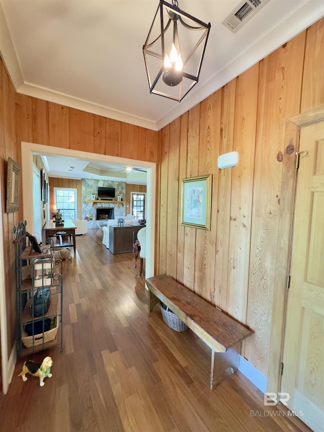 51600 State Highway 59, Bay Minette, AL 36507 - hallway featuring wooden walls, wood finished floors, a chandelier, and ornamental molding