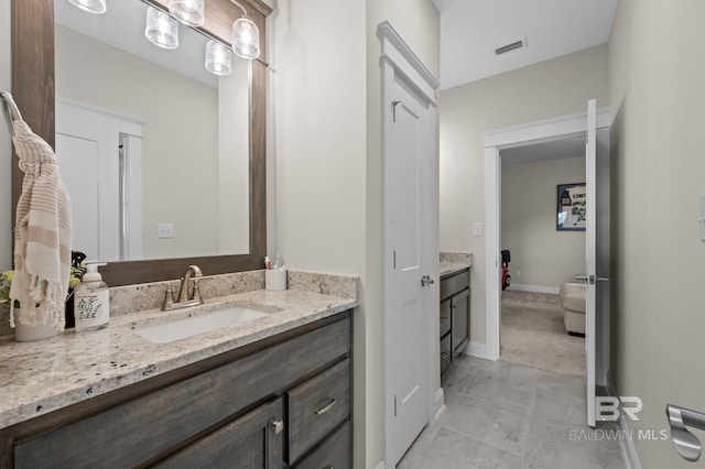 bathroom featuring vanity and tile patterned flooring