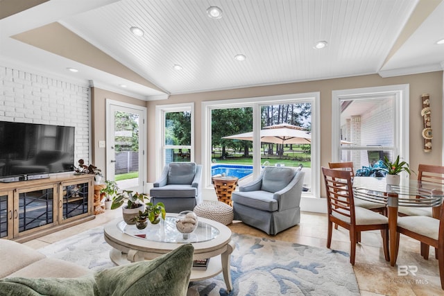 607 Wedgewood Dr, Gulf Shores, AL 36542 - living area with plenty of natural light, lofted ceiling, recessed lighting, crown molding, and light tile patterned flooring