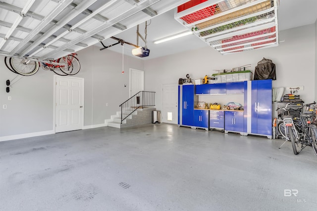 607 Wedgewood Dr, Gulf Shores, AL 36542 - garage featuring a garage door opener and baseboards