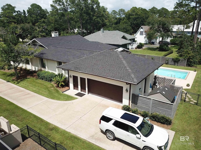 607 Wedgewood Dr, Gulf Shores, AL 36542 - view of front of property with a shingled roof, a garage, and driveway