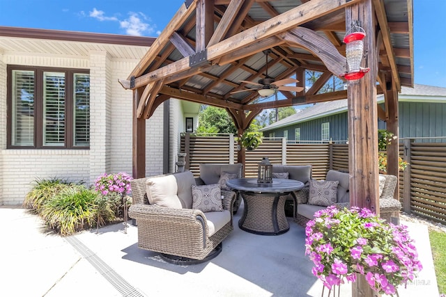 607 Wedgewood Dr, Gulf Shores, AL 36542 - view of patio featuring ceiling fan, a gazebo, and an outdoor hangout area