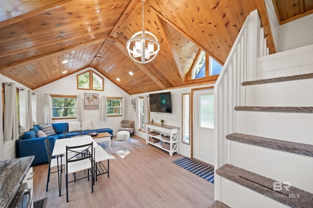 living room featuring a notable chandelier, high vaulted ceiling, light wood-type flooring, and wooden ceiling