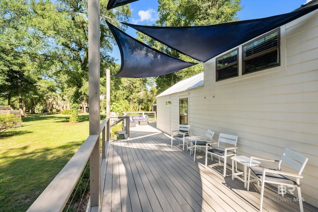 deck featuring a lawn