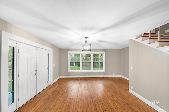 foyer featuring a notable chandelier and hardwood / wood-style flooring