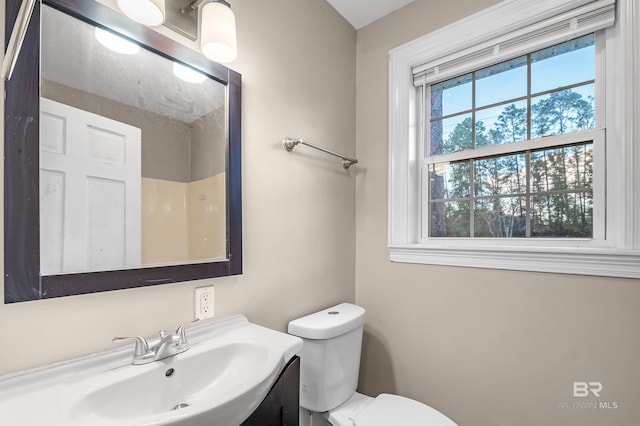 bathroom featuring toilet and sink