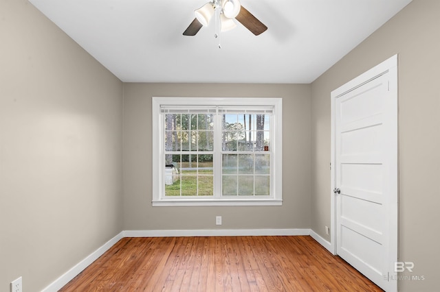 unfurnished room featuring light hardwood / wood-style floors and ceiling fan