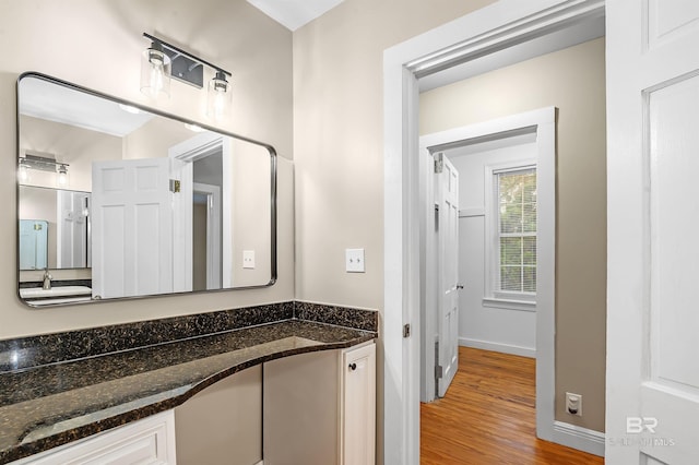 bathroom with vanity and wood-type flooring