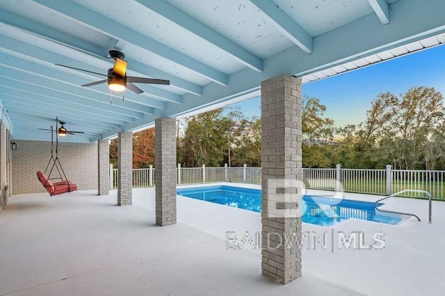 view of pool with a patio area and ceiling fan