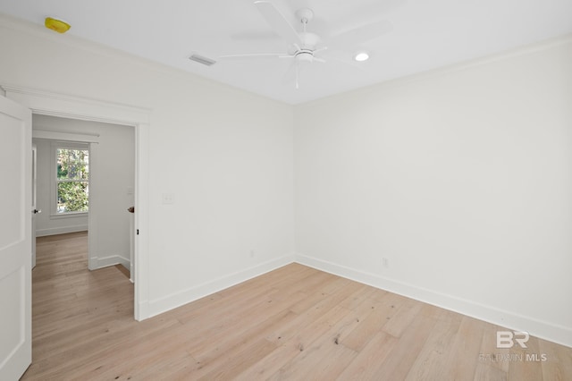 spare room with ceiling fan and light hardwood / wood-style floors