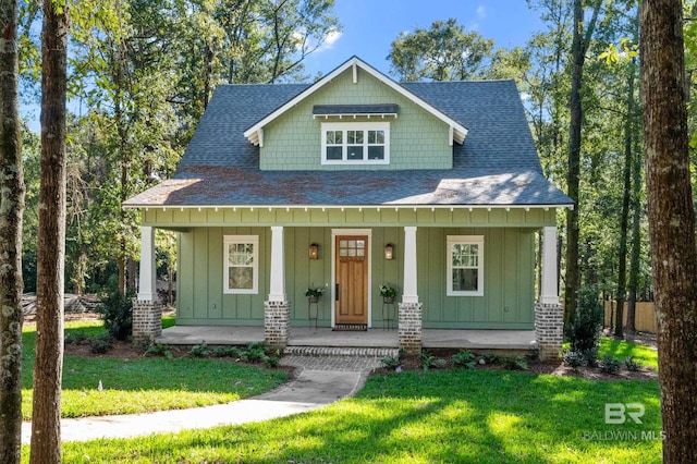 view of front of home with a front lawn and covered porch