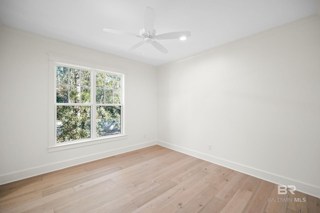 unfurnished room featuring ceiling fan, light hardwood / wood-style floors, and ornamental molding