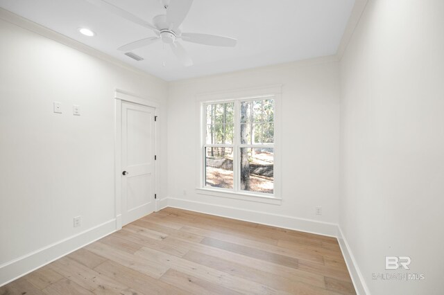 unfurnished room featuring ceiling fan, ornamental molding, and light hardwood / wood-style flooring