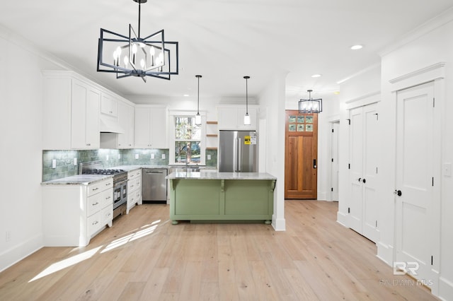 kitchen featuring white cabinets, a kitchen island, stainless steel appliances, and custom exhaust hood