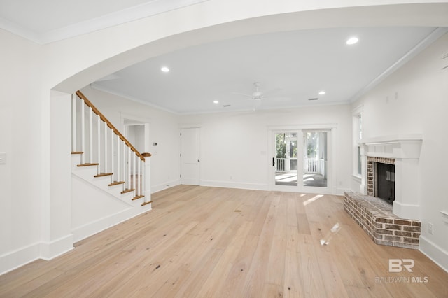 unfurnished living room featuring ceiling fan, light hardwood / wood-style floors, and ornamental molding