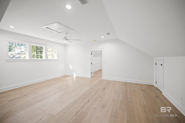 bonus room with light hardwood / wood-style flooring and lofted ceiling