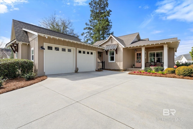 ranch-style home with driveway, a shingled roof, a garage, and board and batten siding